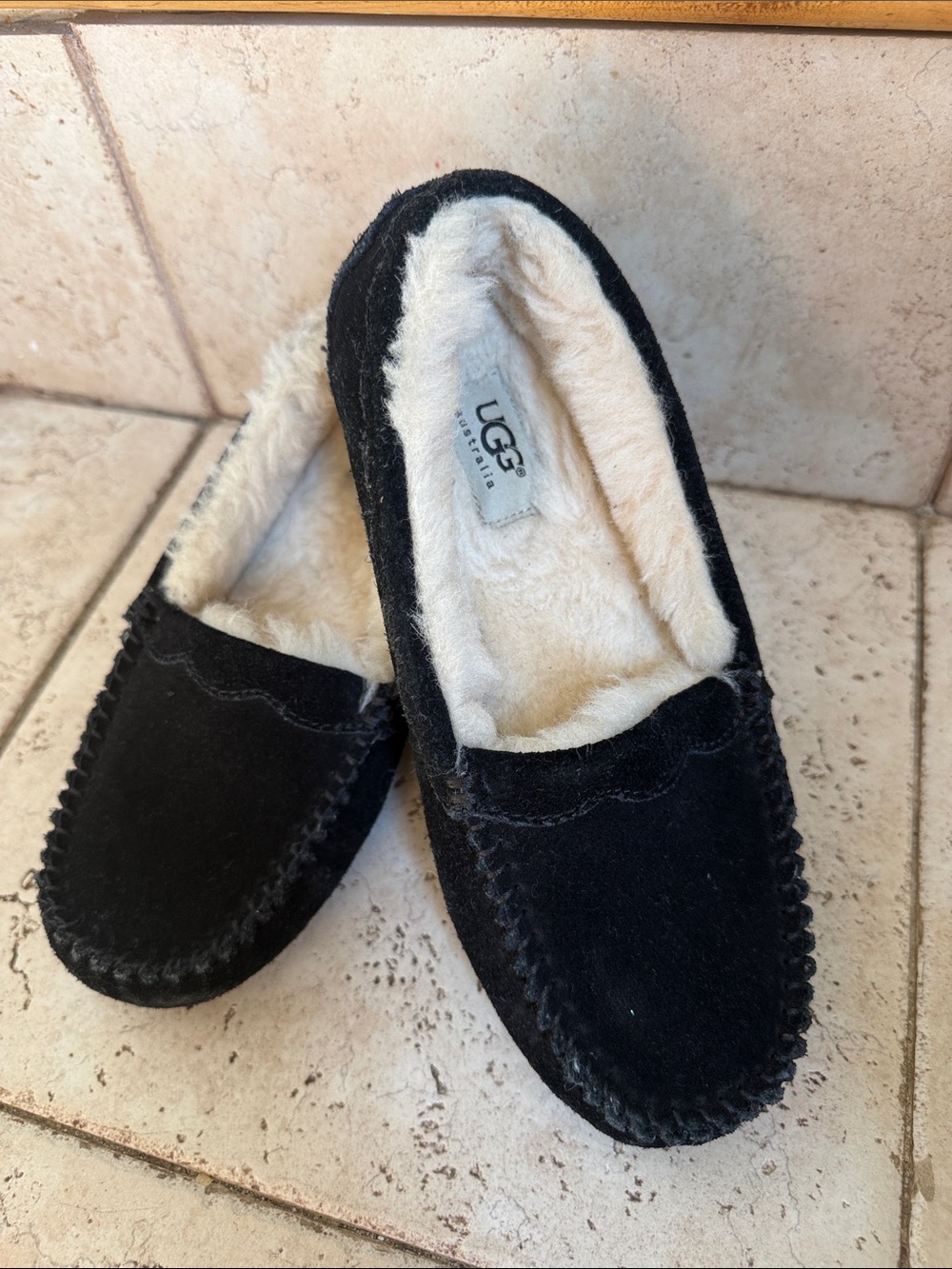 UGG Kids Black Suede Moccasin Slippers with Cream Shearling Lining